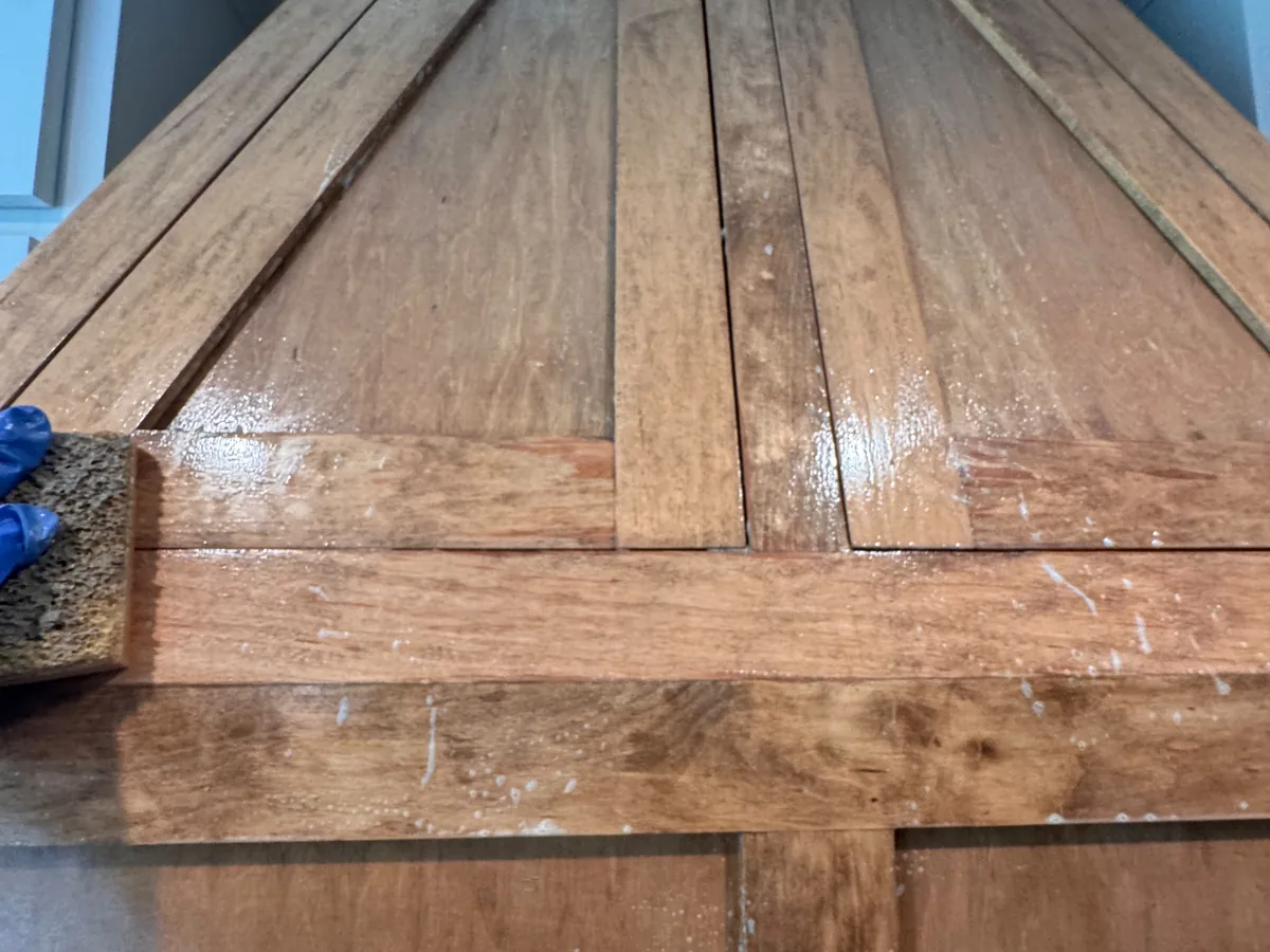 Close up of wide hardwood planks freshly cleaned and still damp
