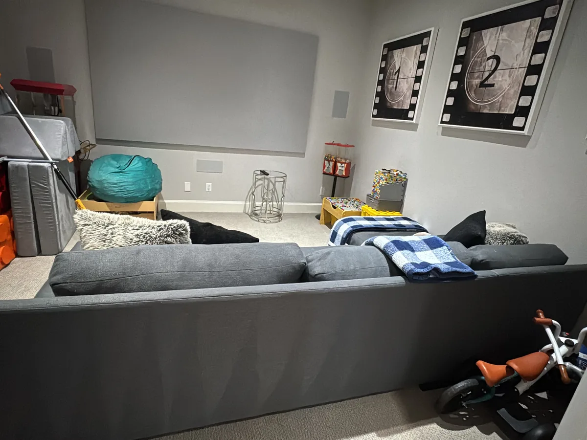 Tidy playroom with toys stacked neatly and a clear floor after a room cleaning
